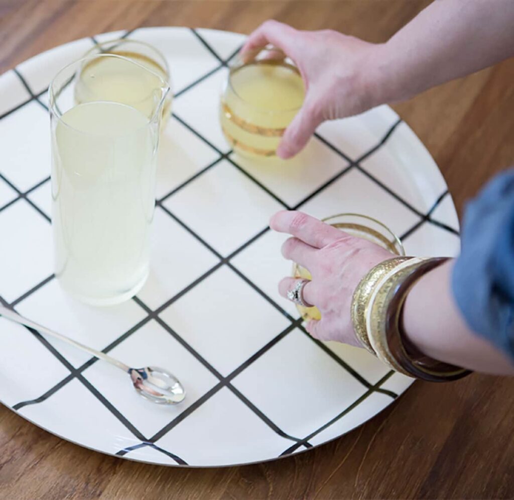 After prepping your cocktail, pop your glassware on a fun tray to serve.