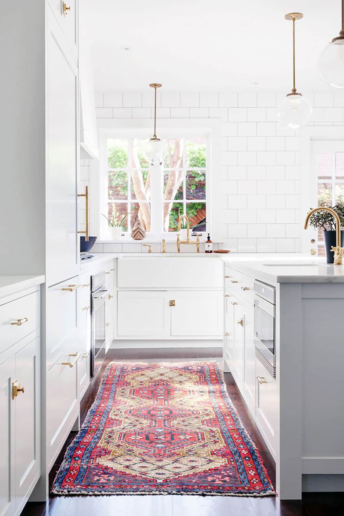 white modern kitchen with persian rug