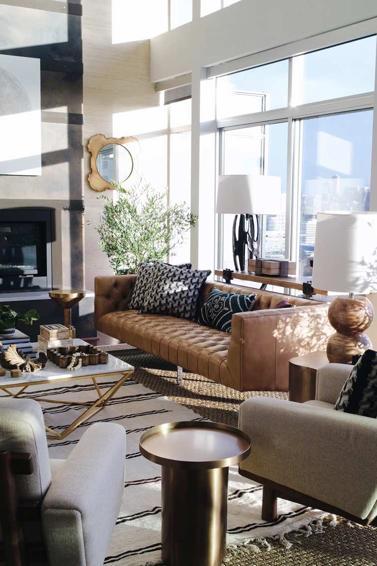 Living room Mid Century Modern inspired design. Love the layered rugs and the leather camel colored sofa. Seattle Showhouse. Interior design by Decorist with ATGstores.com and Porch. Click to see more of the House on House Of Hipsters blog. 