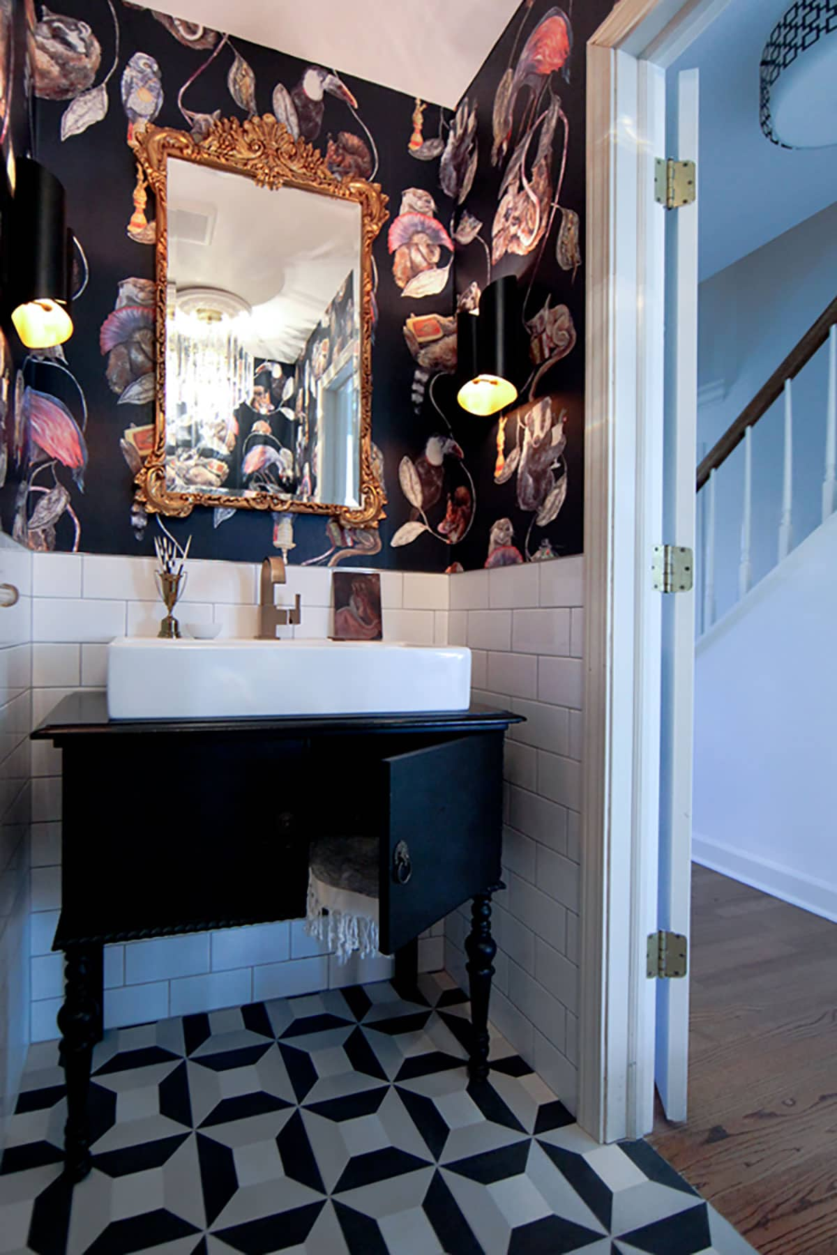 Eclectic bathroom makeover with bold black wallpaper