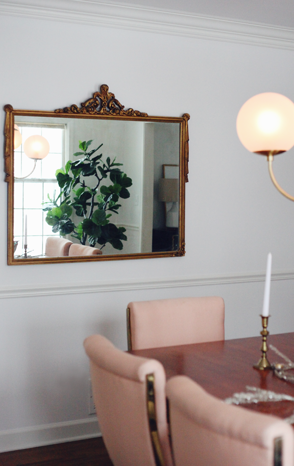 The formal dining room and pink Pierre Cardin brass cantilever chairs. And gorgeous antique gilded mirror. Check out those tassels. Oh so Hollywood Regency.