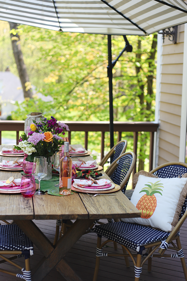 Outdoor Entertaining in the Neighborhood - Loving the pop of pink and green with the pineapple pillow. #Pier1BlockParty #pier1love