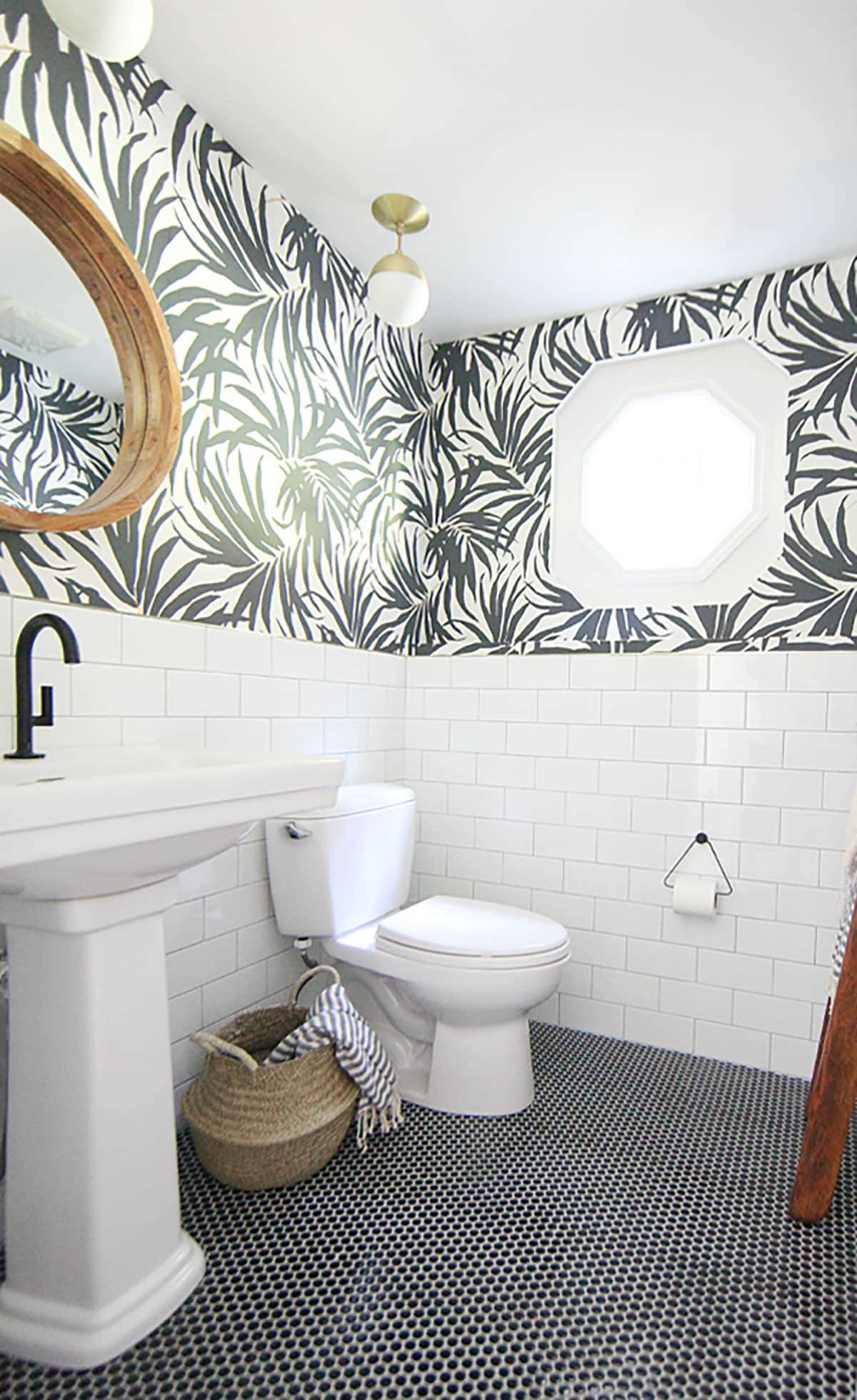 Black and white palm leaf wallpaper in modern bathroom design