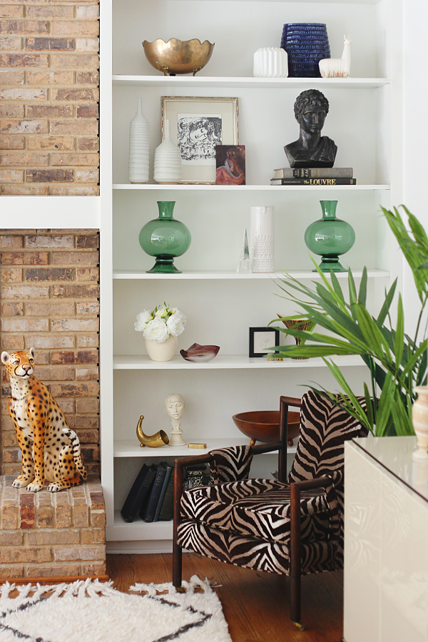 Shelf styling with vintage home decor. A pair of Sara Paloma stem vases from Everything But The House.