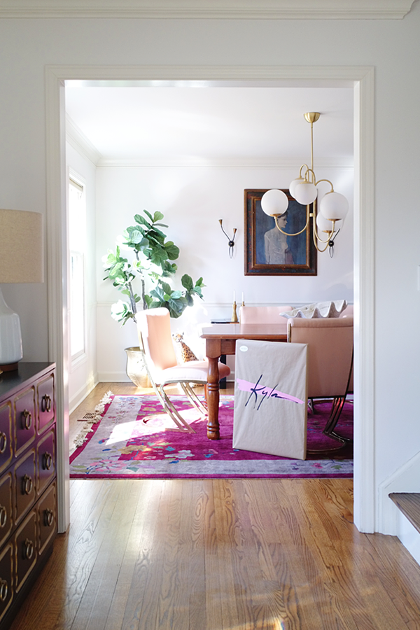 Pink dining room - Statement art, big art, pink and brass chairs. Kyla — A collab, Josh Young Design House X House Of Hipsters #statementart #vintage #midcenturymodern #hollywoodregency #eclectichomedecor #diningroom