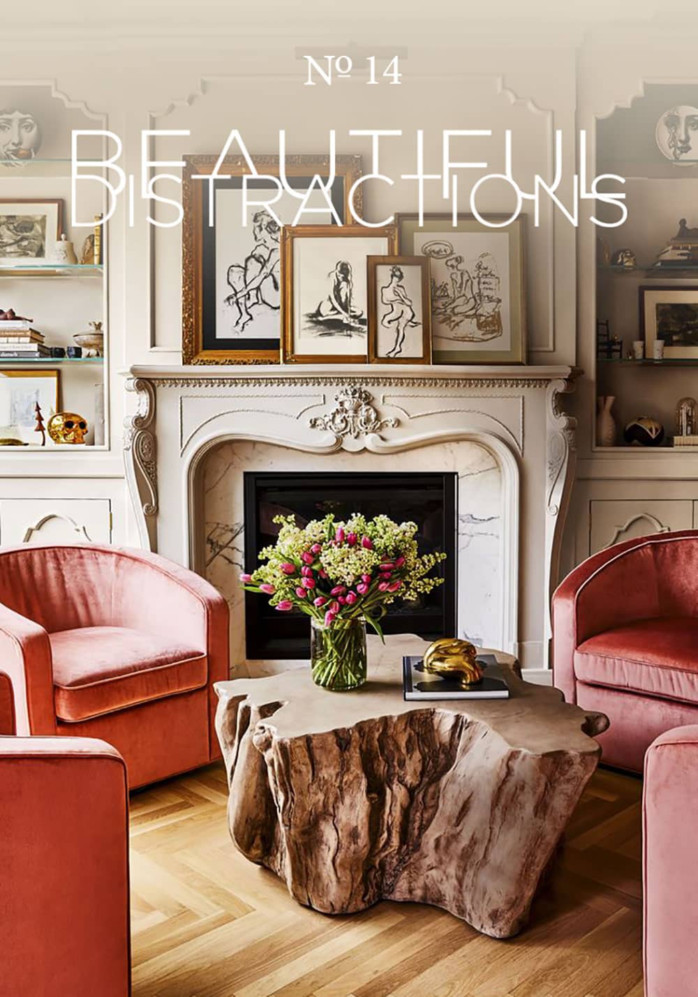 Alison Victoria's Chicago home in House Beautiful - Love the pink velvet club chairs and antique marble fireplace with the charcoal nudes.