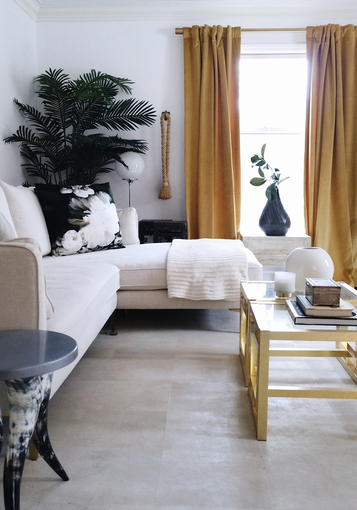 living room home decor with vintage objects and goldenrod velvet curtains