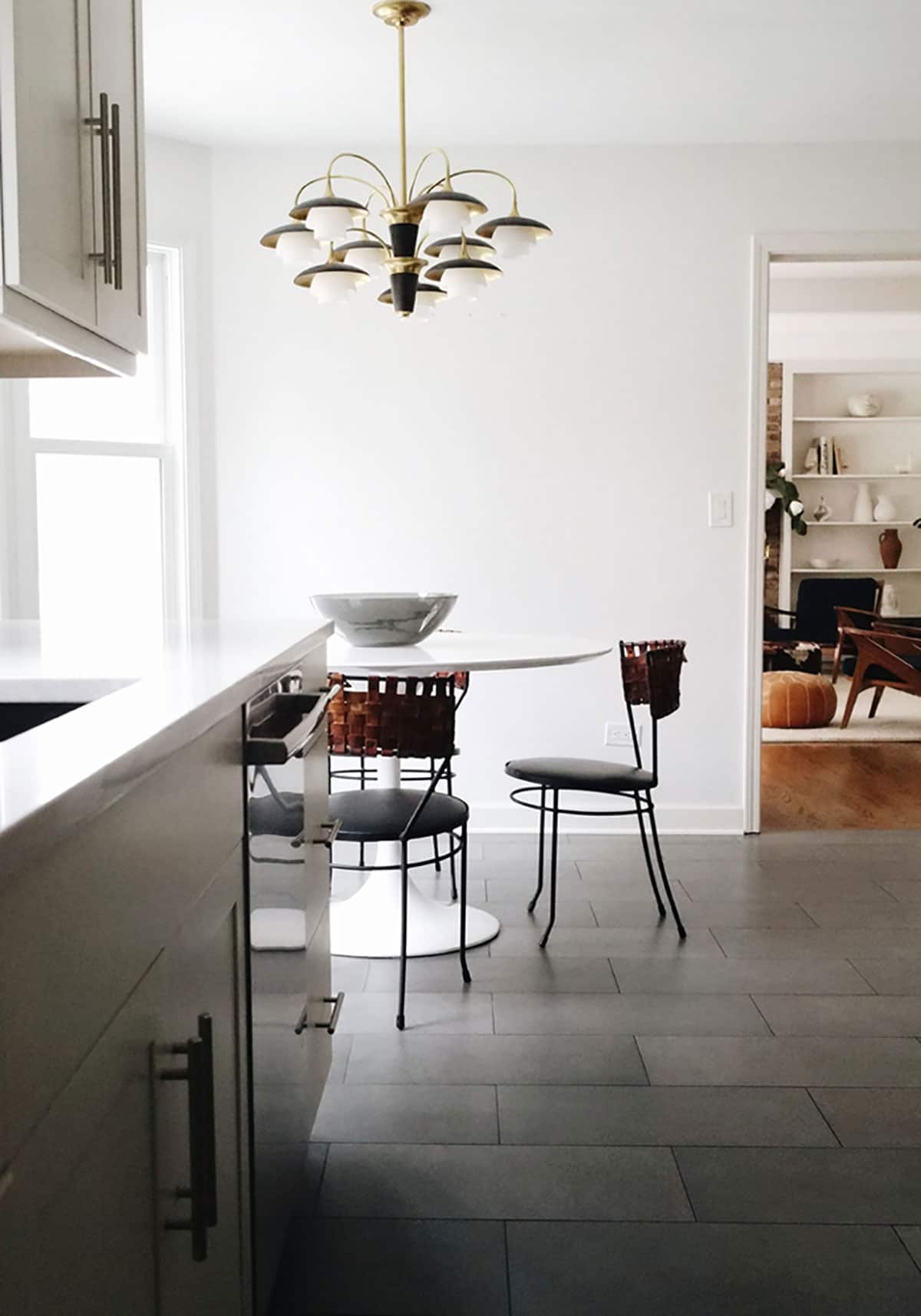 mid cetury modern white tulip table in kitchen