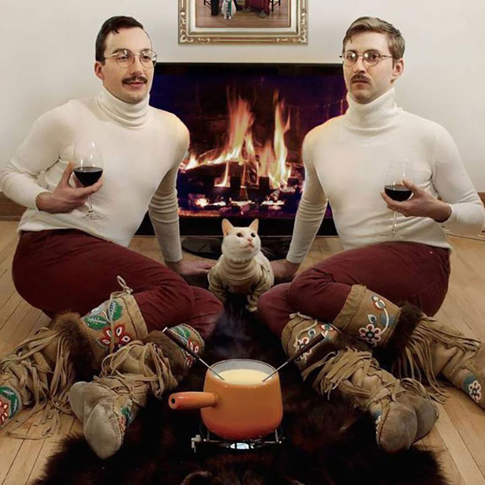 Men photographed with their cats