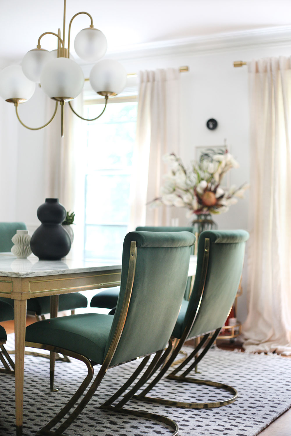 Reupholstered dining chairs in green and brass cantilever chairs by Pierre Cardin