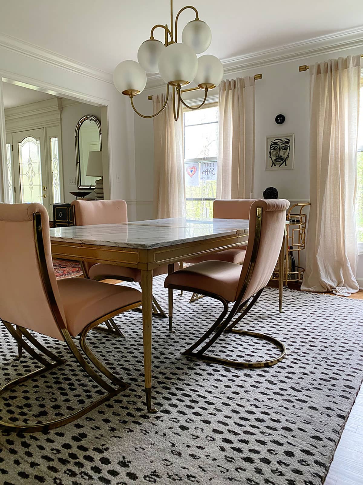Eclectic dining room with original brass cantilever chairs by Pierre Cardin before reupholstering in Ultrasuede performance fabric