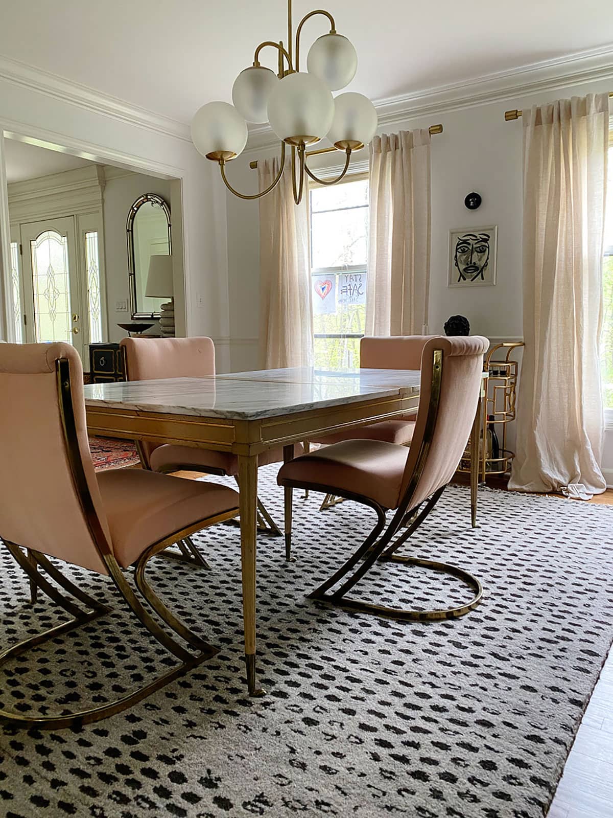 Eclectic dining room 
with original brass cantilever chairs by Pierre Cardin before reupholstering in Ultrasuede performance fabric