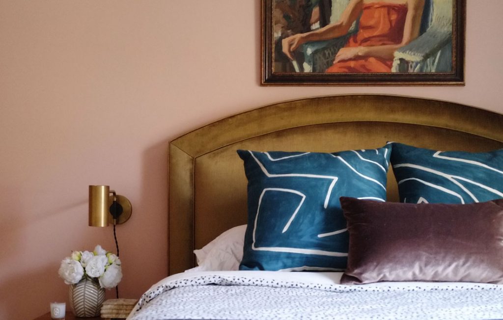 Guest bedroom makeover mood board with bold earthy colors