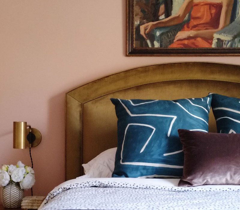 Guest bedroom makeover mood board with bold earthy colors