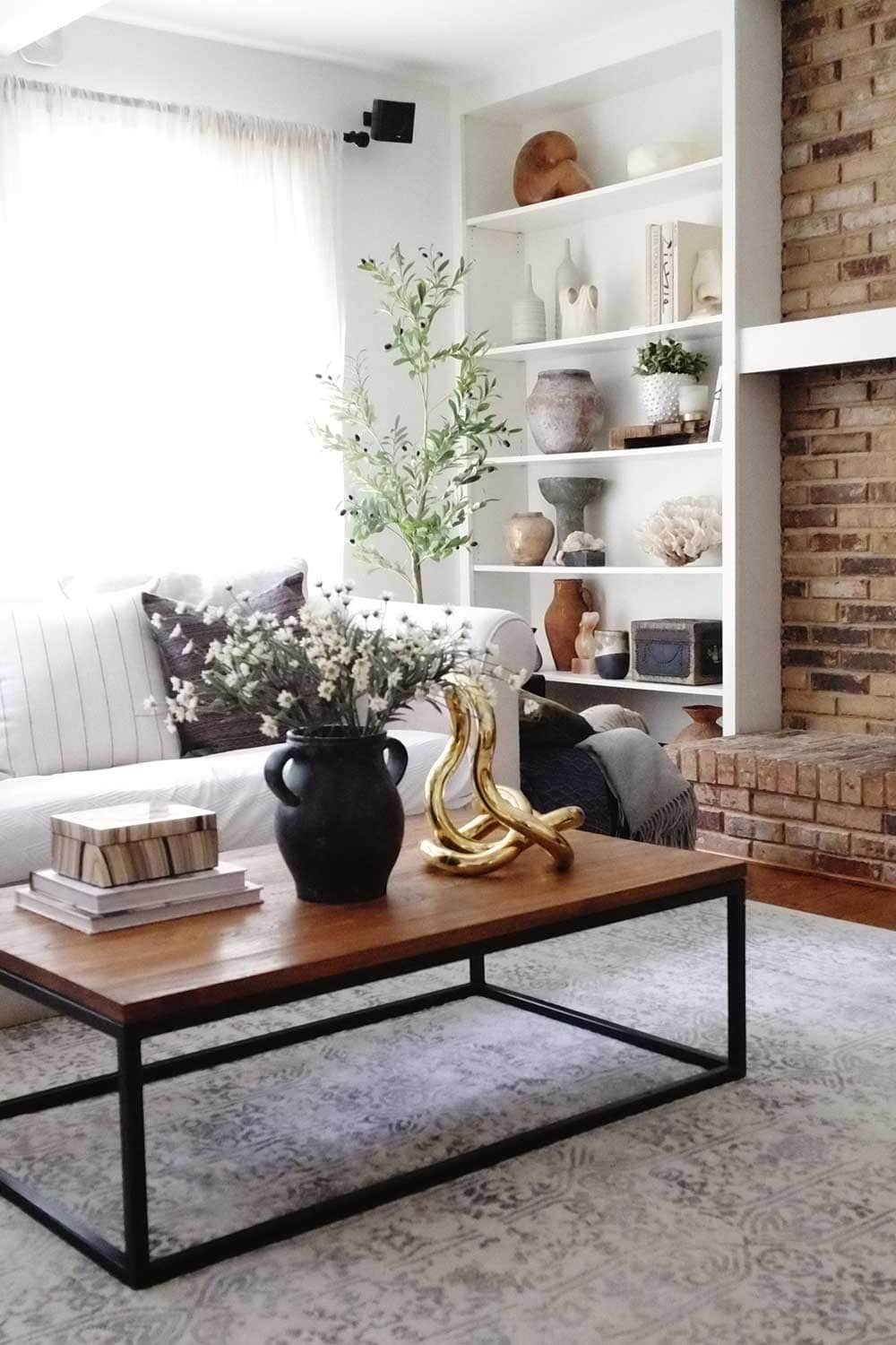 modern living room with brick fireplace