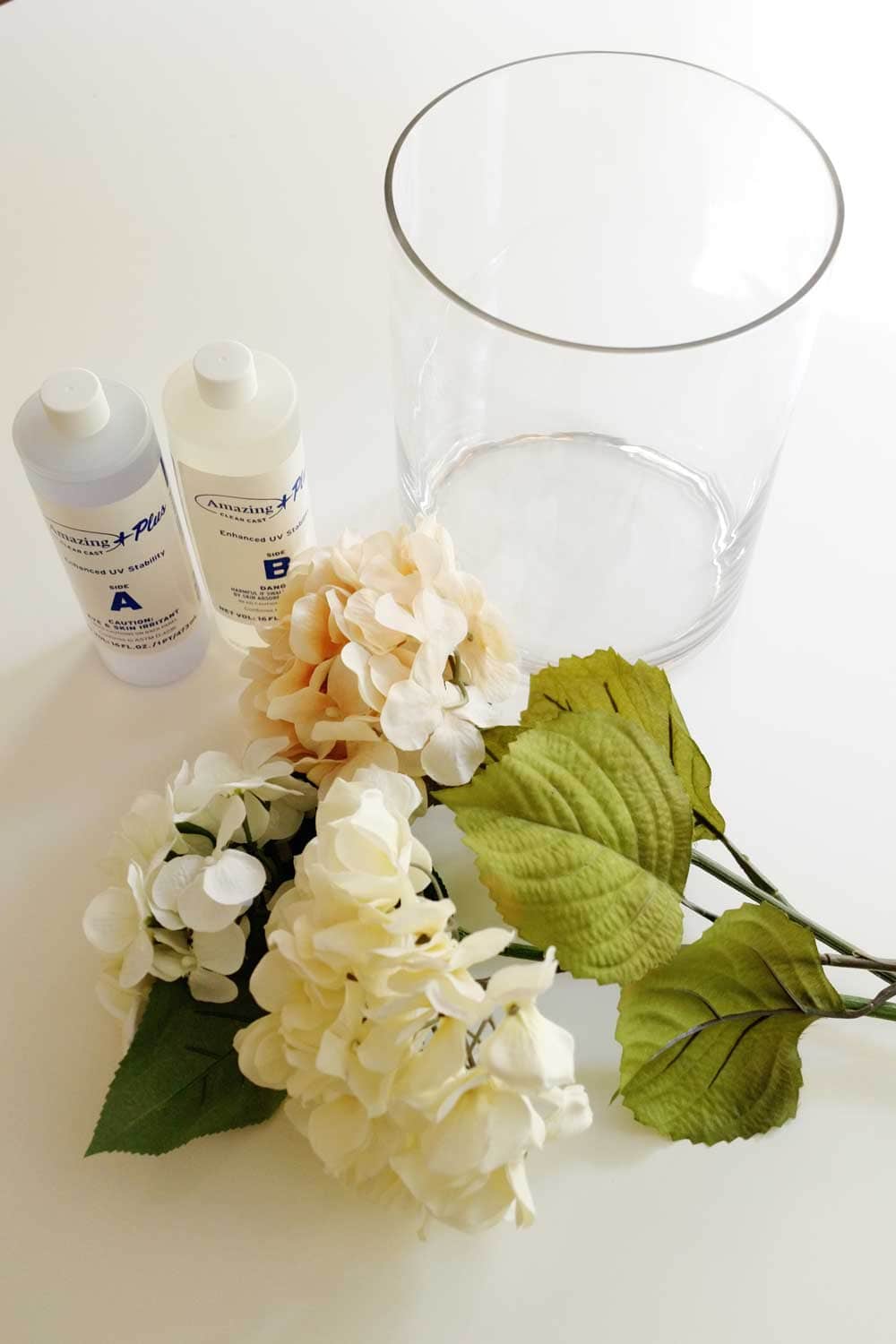Create this DIY Artificial Flower Arrangement in glass vase using resin that looks like water 