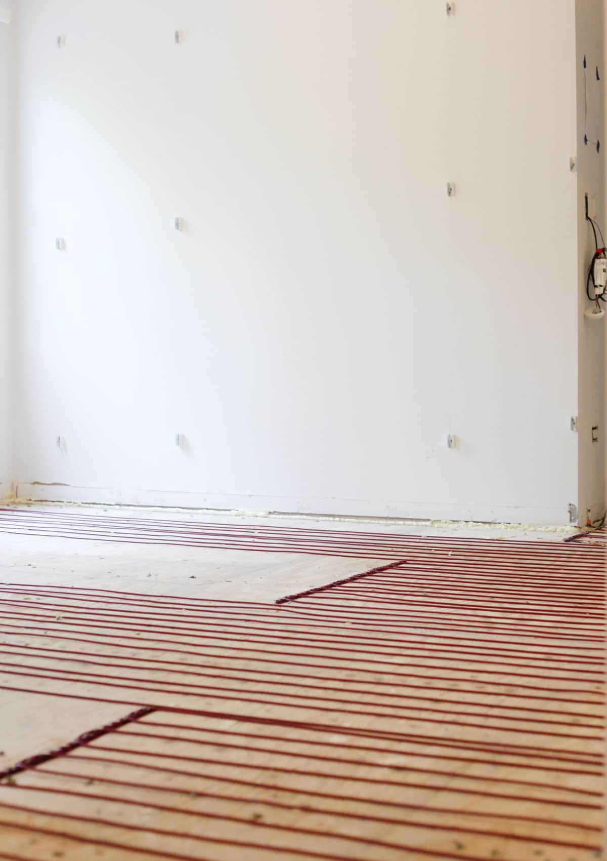 Heated floor installation from WarmlyYours radiant heat install in walk-in closet renovation