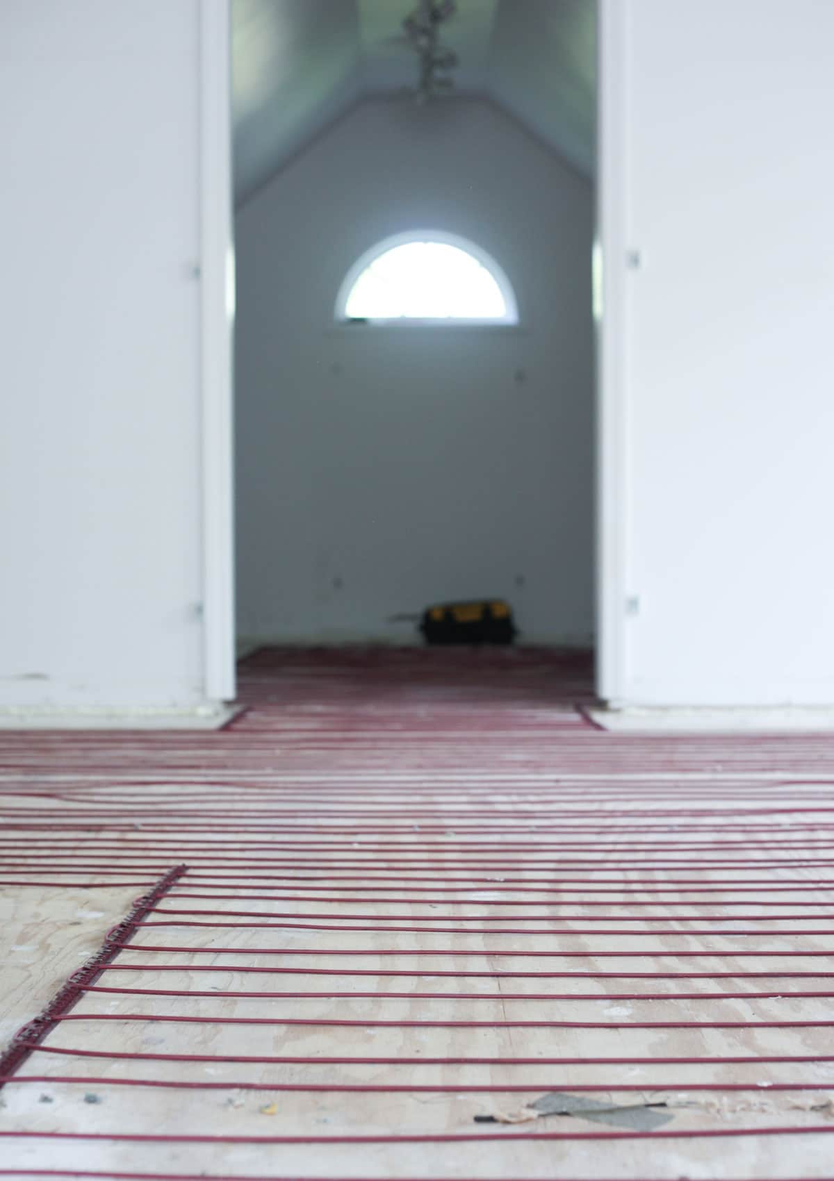 Heated floor installation from WarmlyYours radiant heat install in walk-in closet renovation