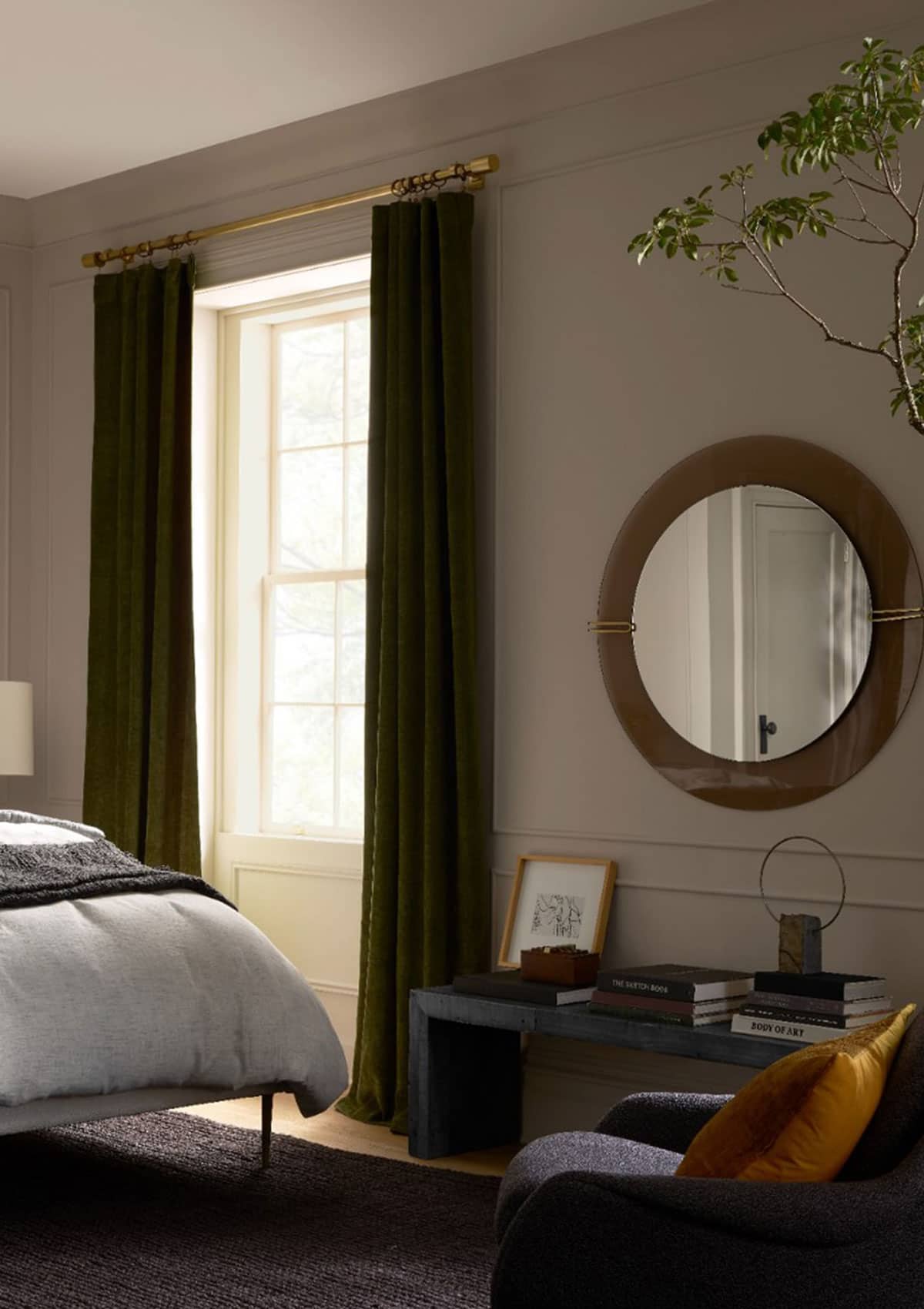 dark green velvet curtains from West Elm are at an affordable price and they look beautiful in this modern bedroom