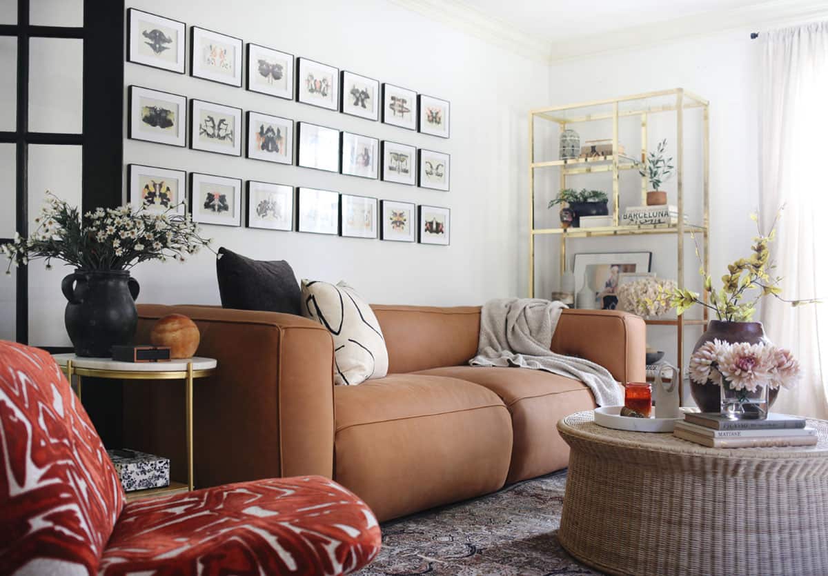 https://houseofhipsters.com/wp-content/uploads/2022/12/eclectic-living-room-brown-leather-couch.jpg