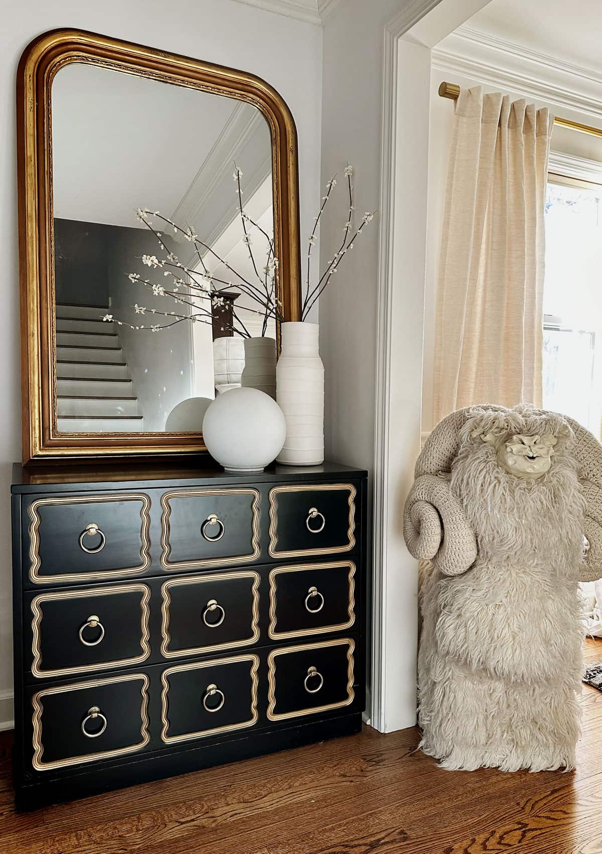 Use a chest of drawers in the foyer to declutter an entryway. 