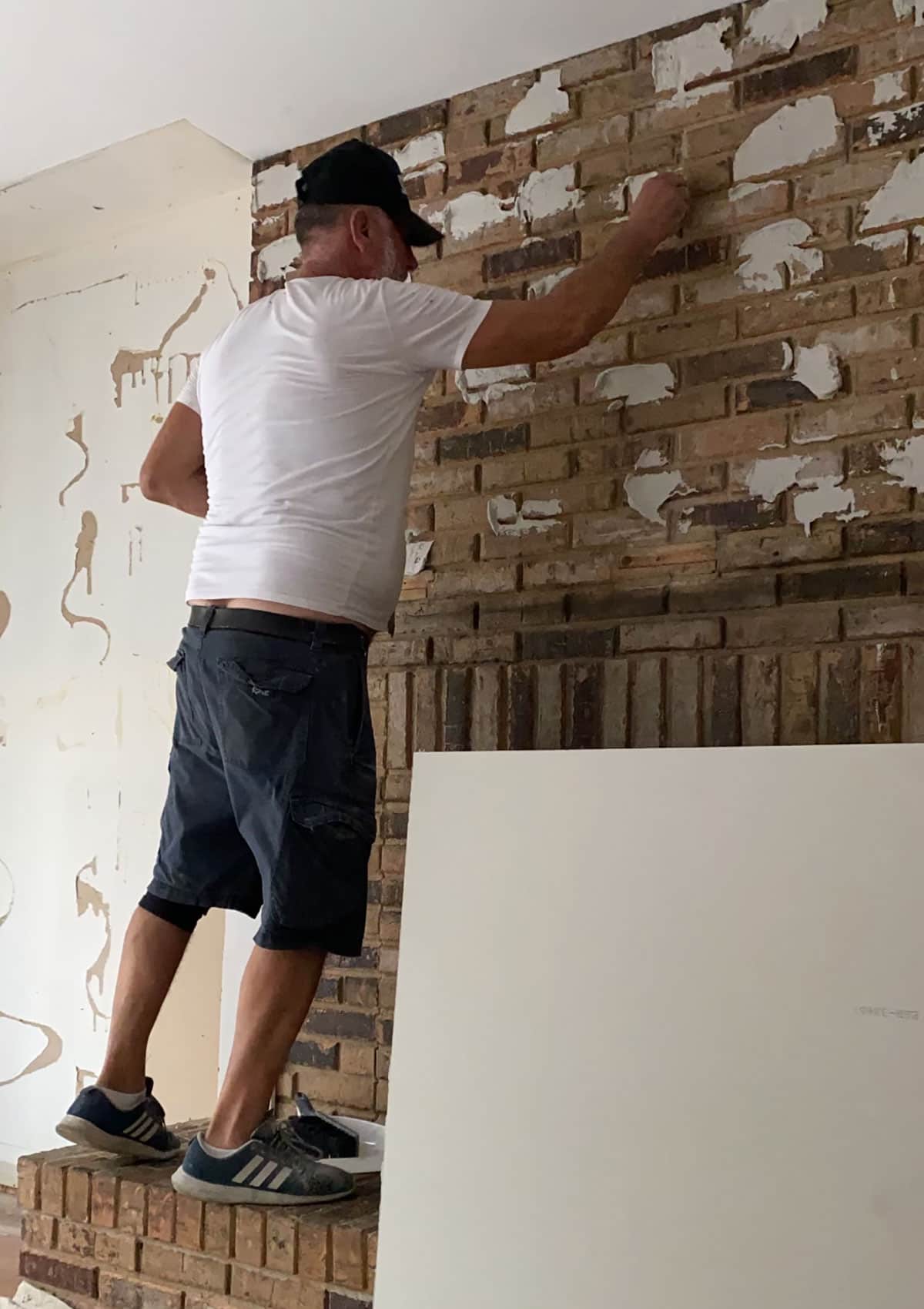 adhering cement board to the old brick wall