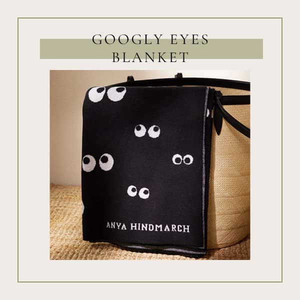 Cozy Throw Blanket with Unique Design - The googly eyes Anya Hindmarch throw blanket is not only cozy but it also shows off some personality.