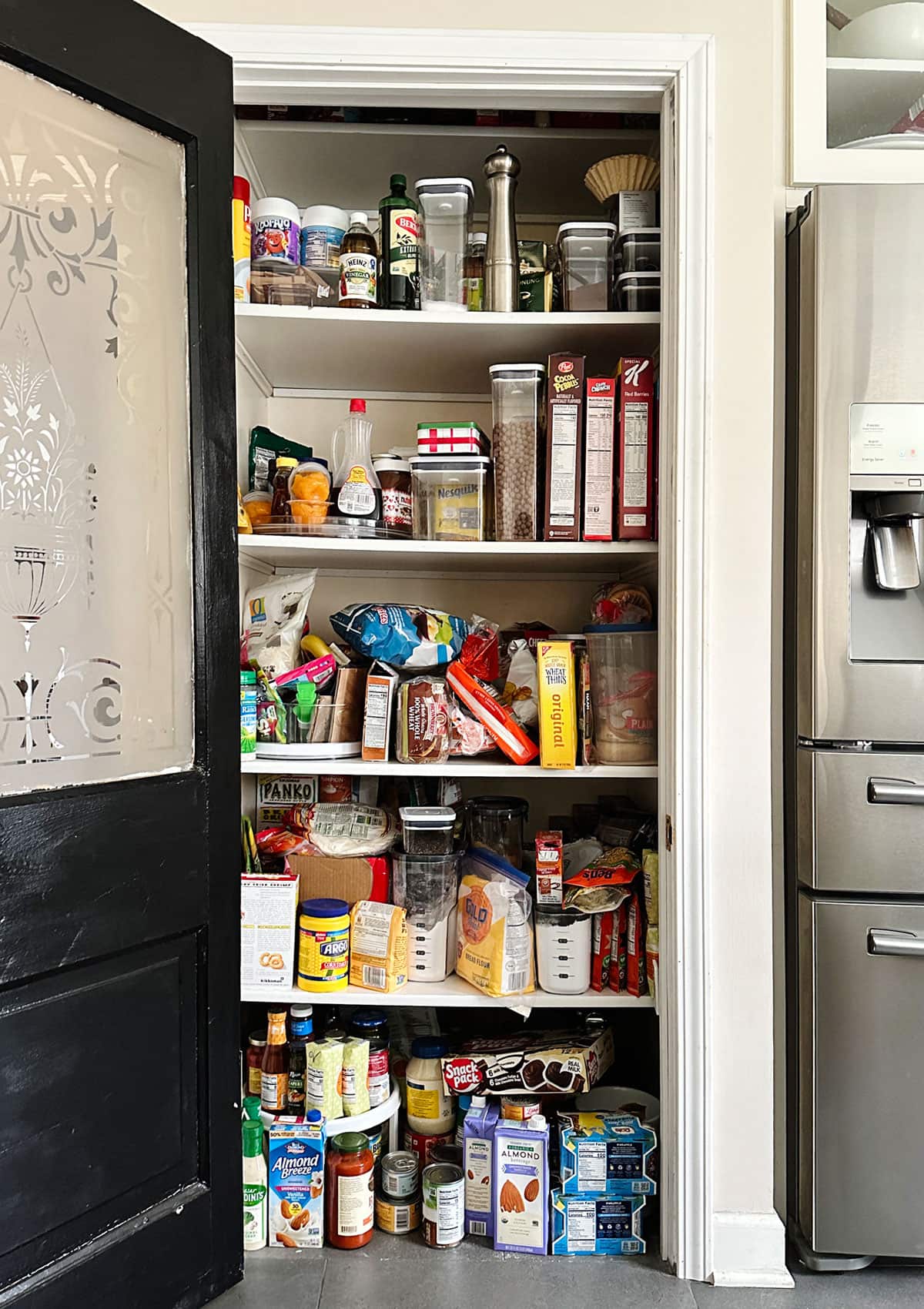 BEFORE Kitchen Pantry Organization - Giving my kitchen pantry a refresh with clever organization ideas and storage bins