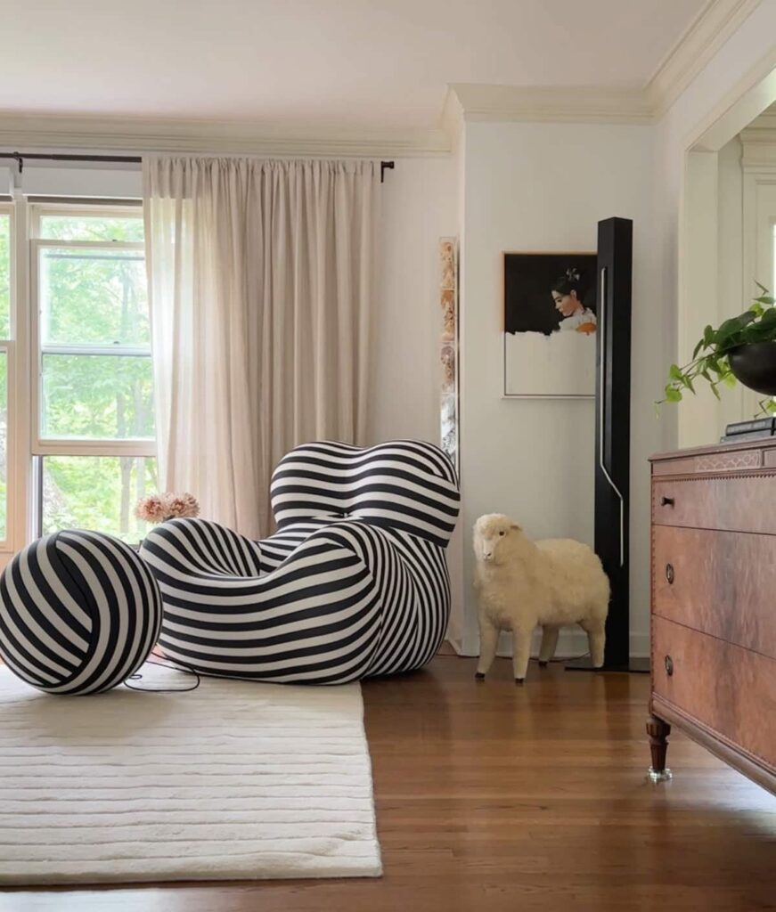 Funky black and white striped chair in ecclectic living room