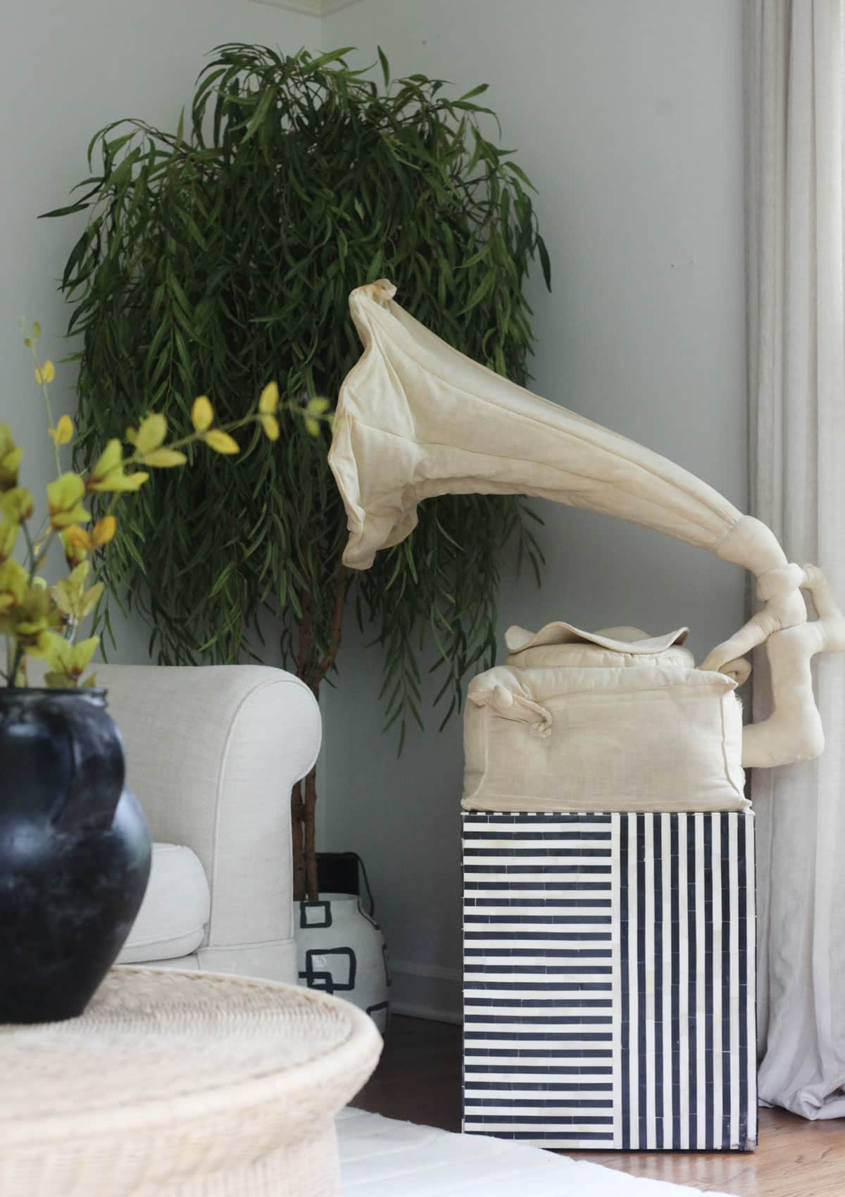 black and white bone inlay table gives this living room a modern look and feel and adds a bold statement