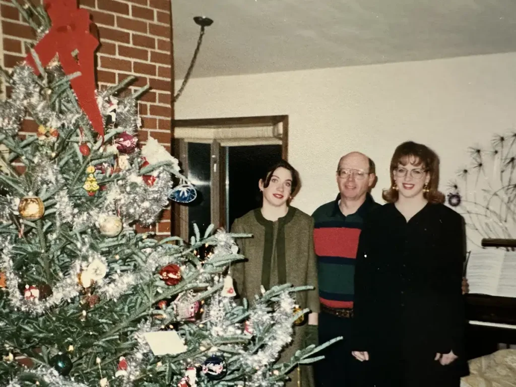 Kyla Herbes family Christmas with tacky tree and decor