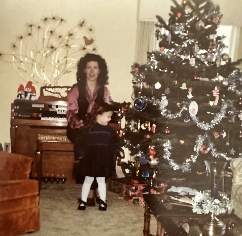 Kyla Herbes family Christmas with tacky tree and decor